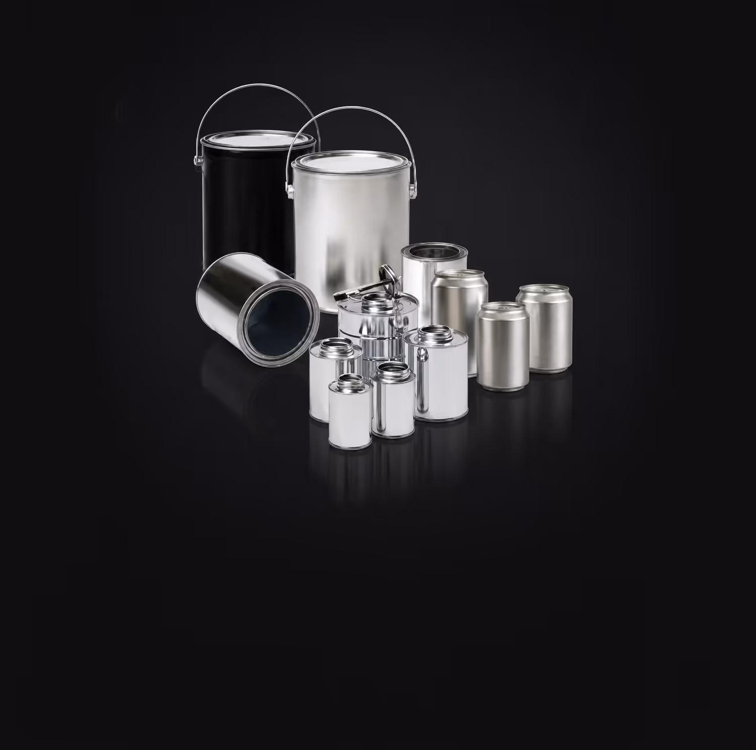 Assortment of silver paint cans and containers of various sizes on black background.