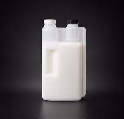 White plastic container with two compartments and two lids, one black and one white, on a black background.