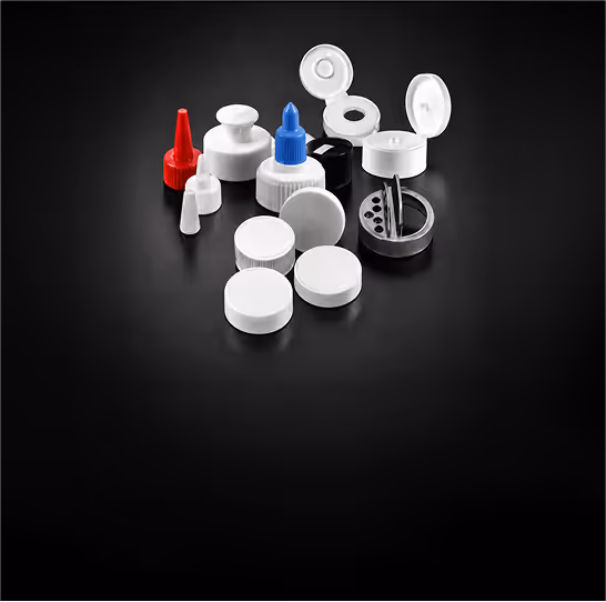 Various plastic caps and dispensing closures in different shapes and colors on a black background.