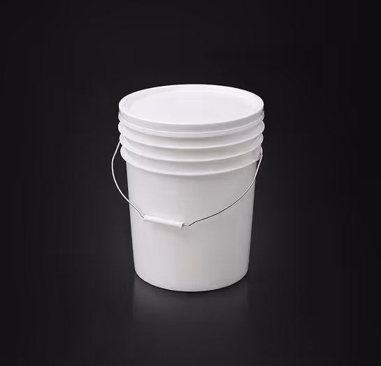 White plastic bucket with a handle and lid on a black background.