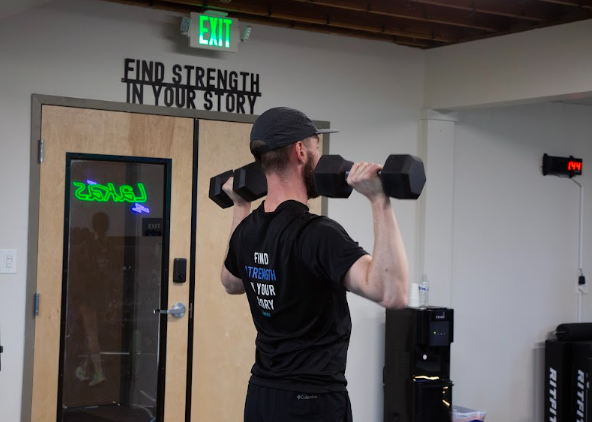  athlete working with physical therapist on movement assessment