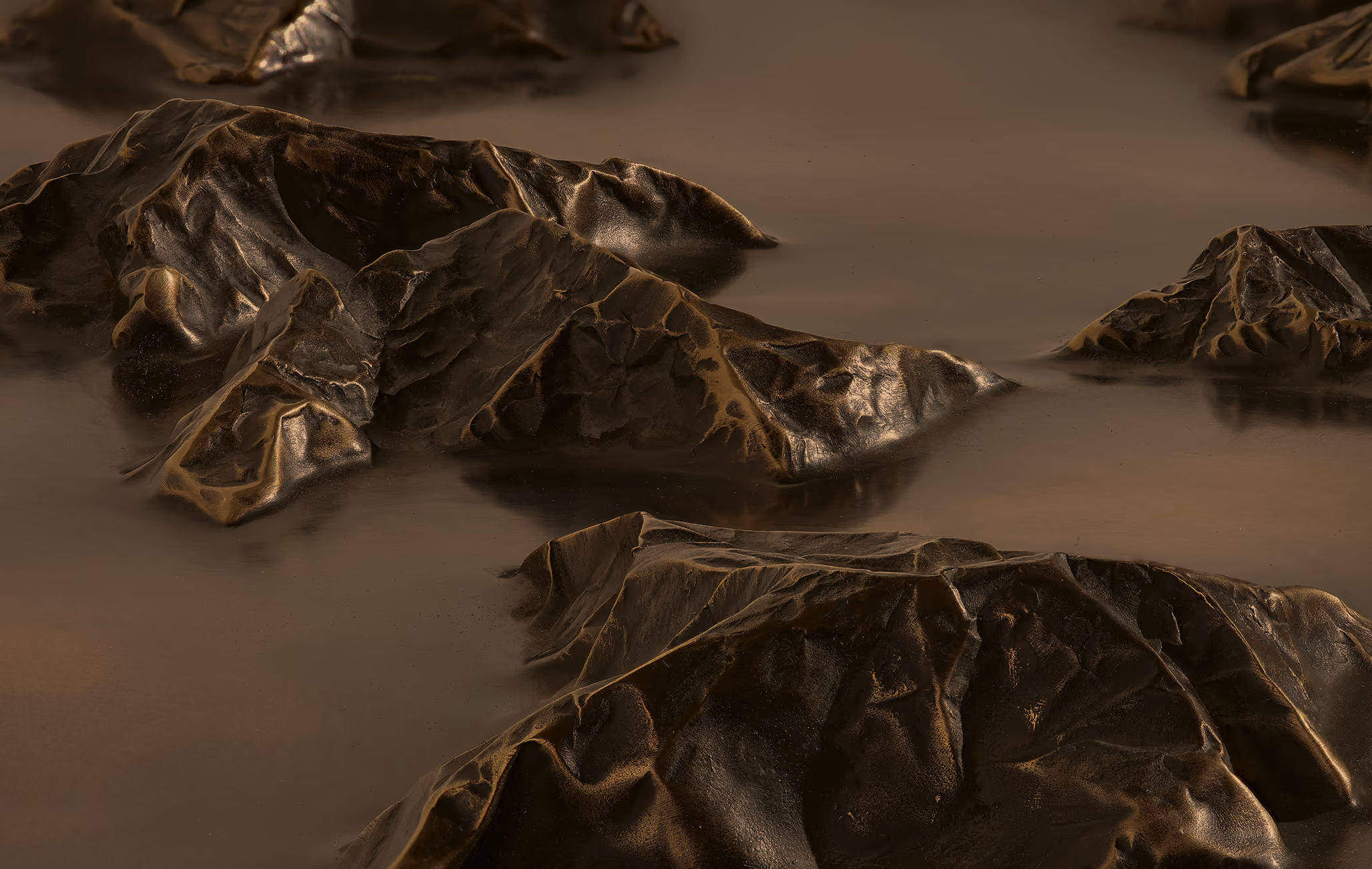 Dark, crumpled, metallic-looking shapes resembling mountain-like forms emerging from a smooth, reflective surface.
