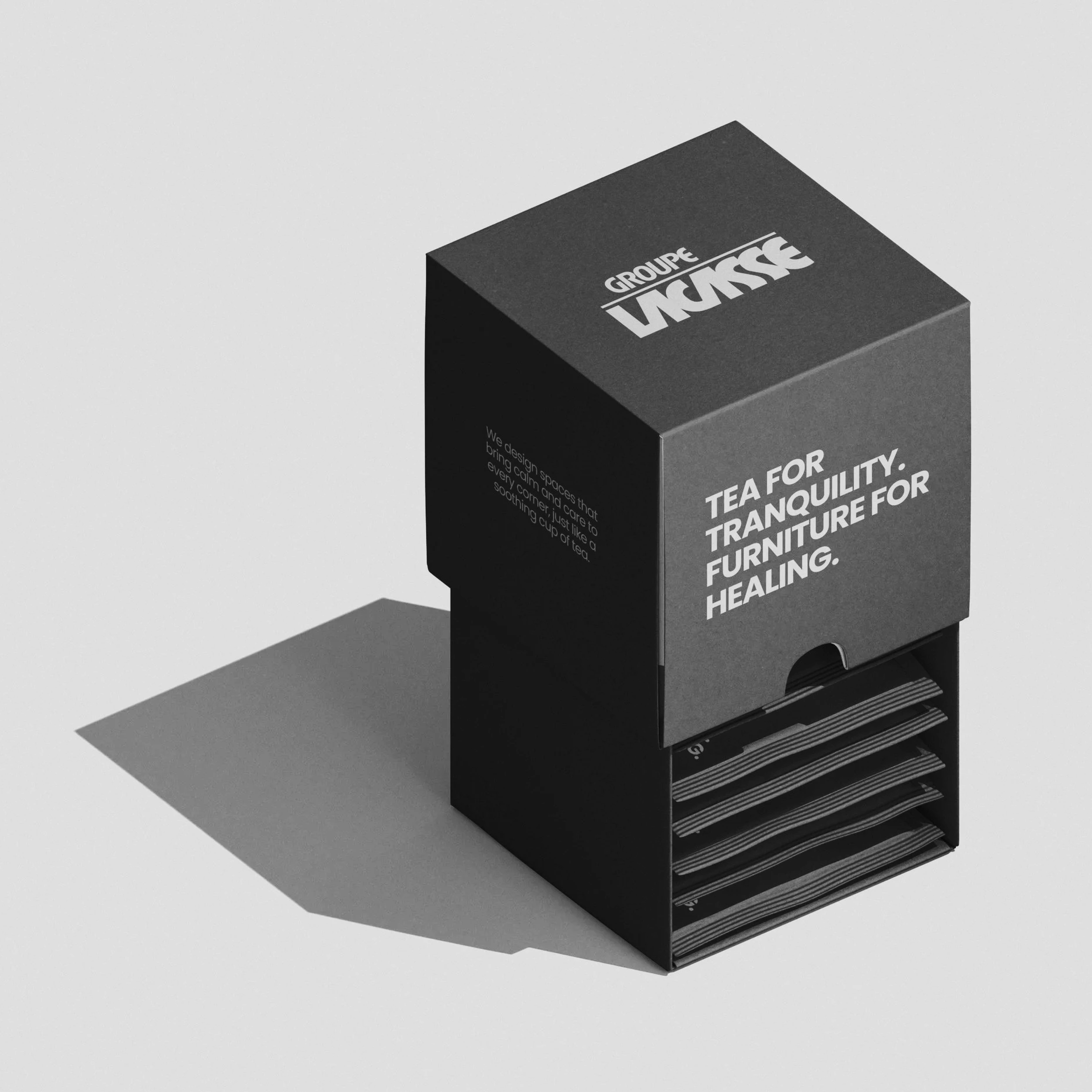 Black box with tea sachets inside and text promoting tea for tranquility and furniture for healing.