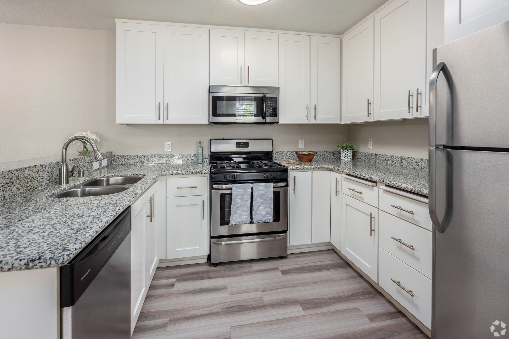 Kitchen with white cabinets and stainless steel appliances