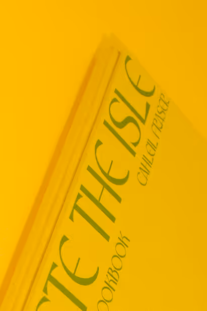 Side of cookbook on yellow background