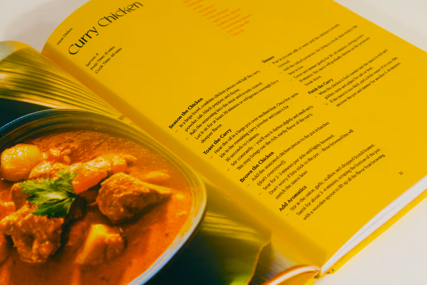 Close-up of cookbook, curry chicken recipe