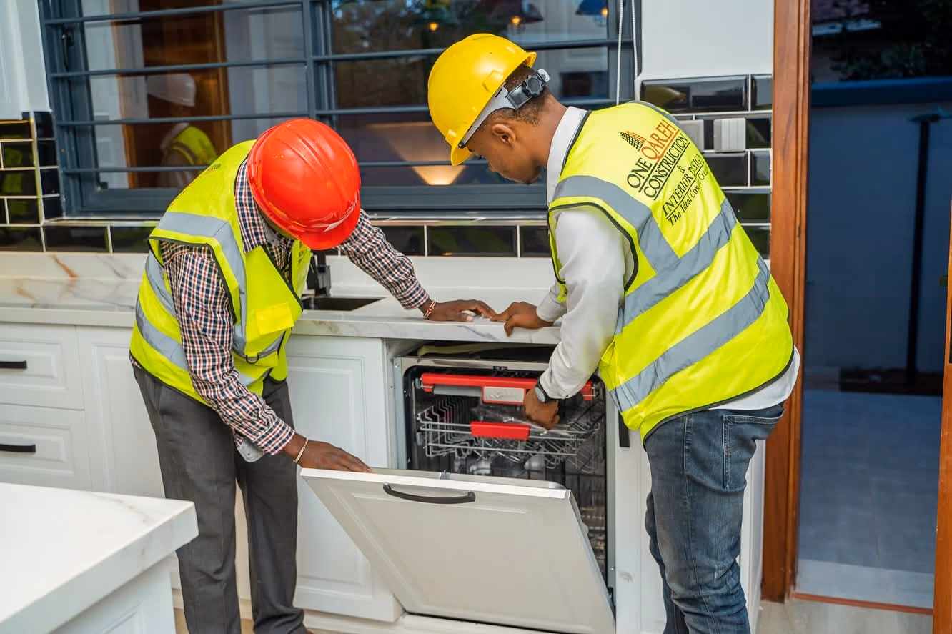 One Qareh team fitting an upgraded kitchen