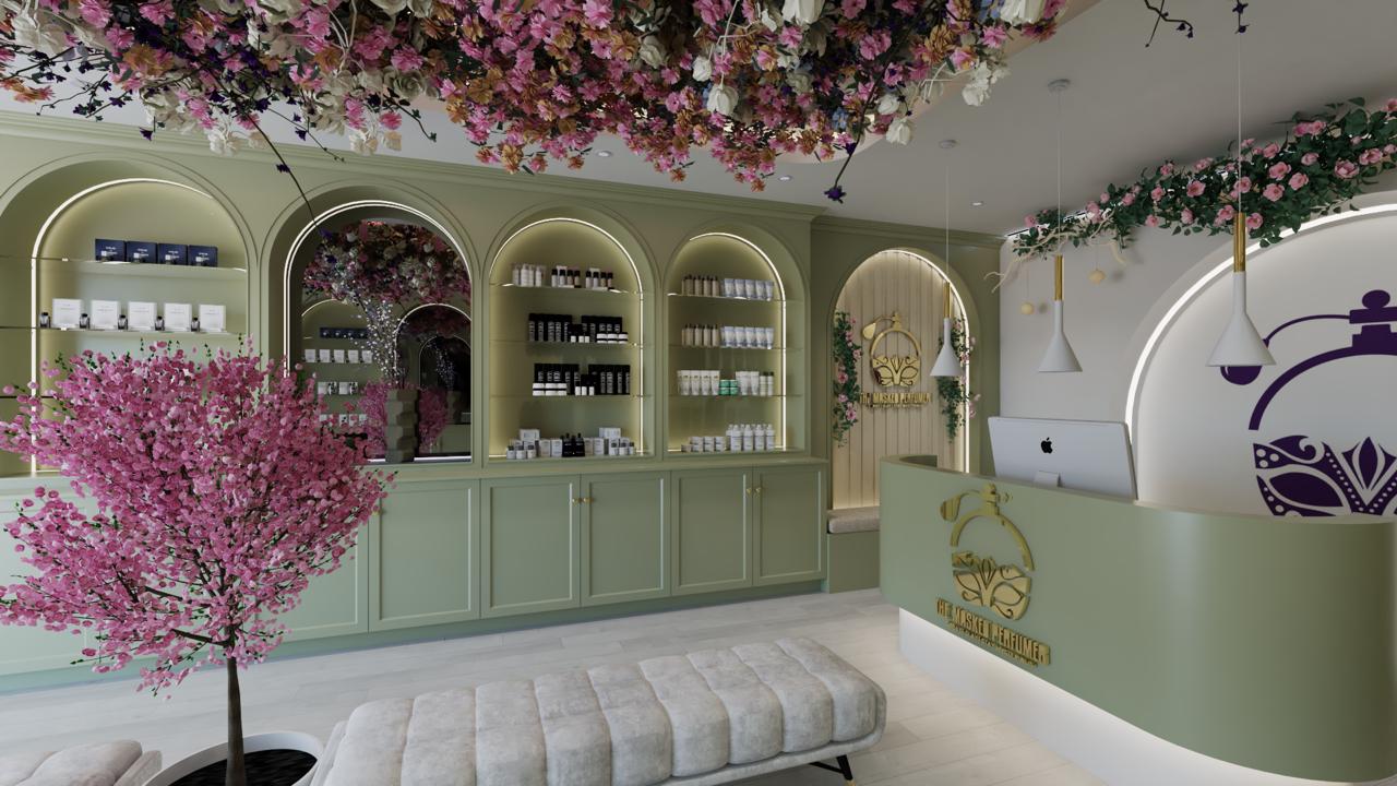 Elegant green boutique interior with illuminated shelves, pink flowering tree, and a reception desk.