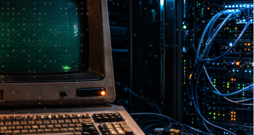 Engineers working in front of multiple monitors