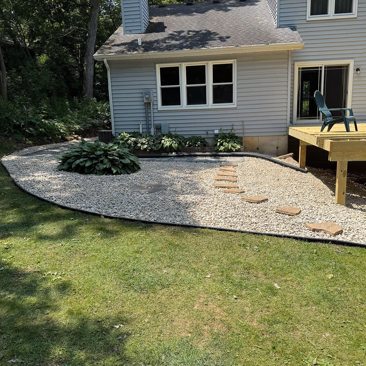 Decorative rock landscaping in Sun Prairie Wisconsin low maintenance beds
