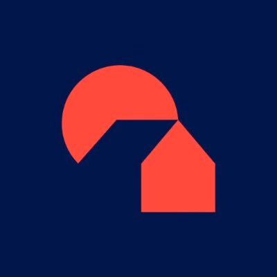 Abstract red geometric shape resembling a house and a circle on a dark blue background.