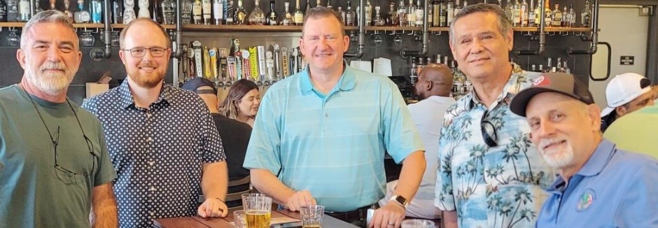 CNF employees gathered together at a social event indoors
