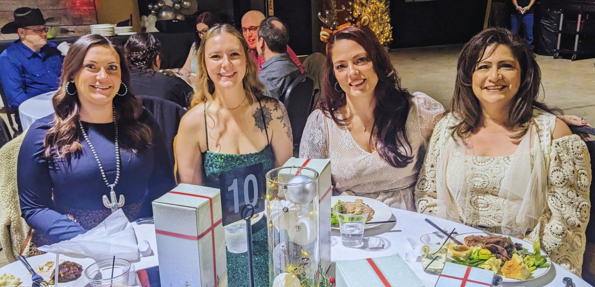 CNF Members at formal dinner table with elegant place settings and decorations