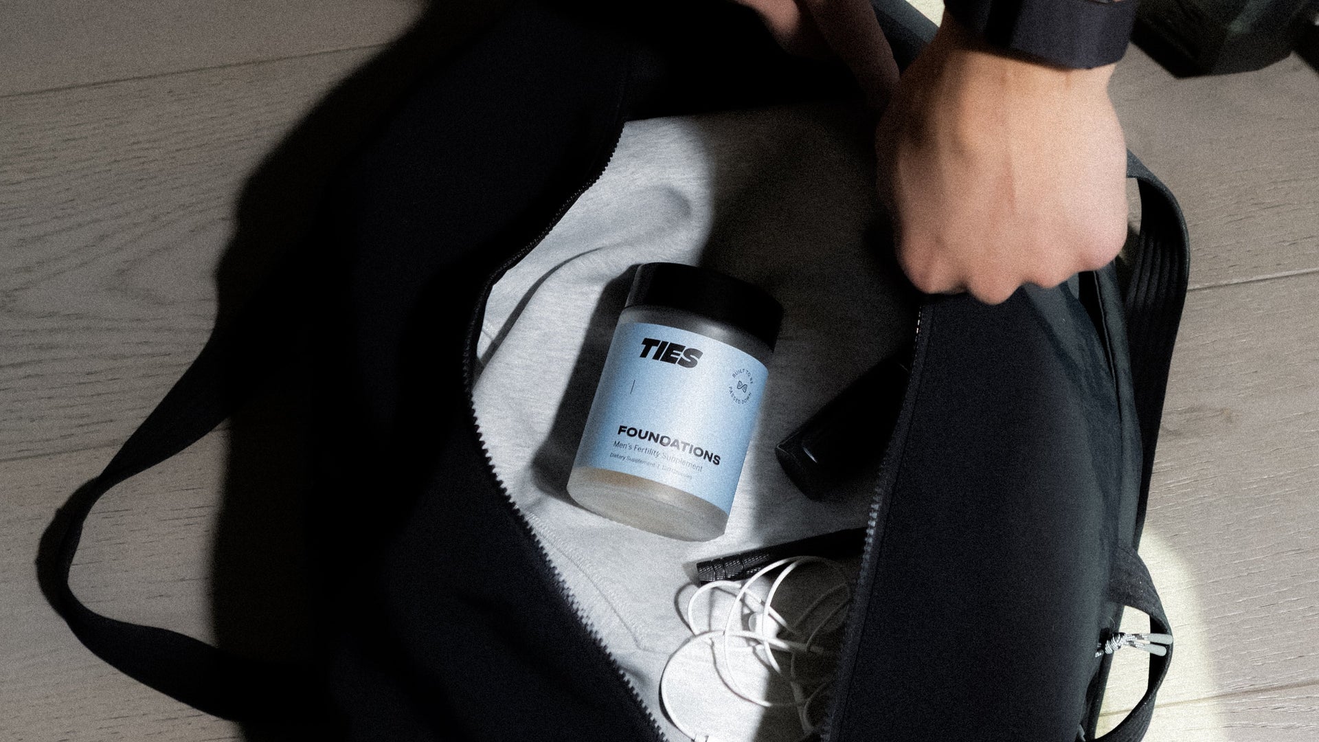 TIES Foundations men's fertility supplement in a gym bag