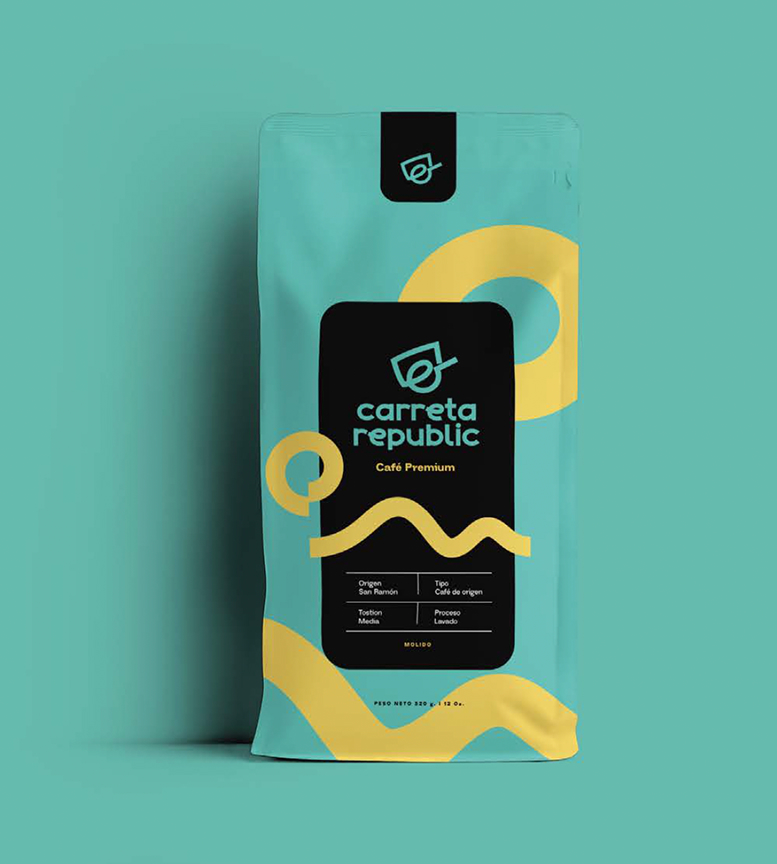 Bag of Carreta Republic Café Premium ground coffee with teal and yellow abstract design on a teal background.