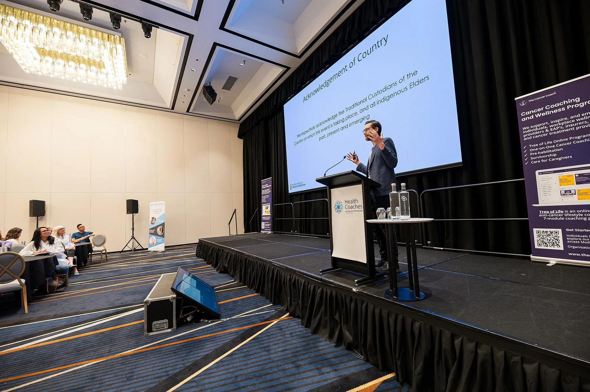 Keynote speaker presenting to delegates at a Brisbane conference
