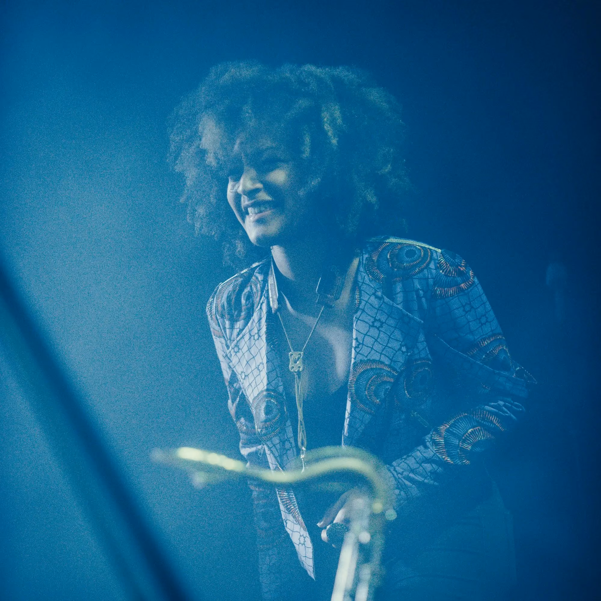 Saxophonist photographed during a live stage performance