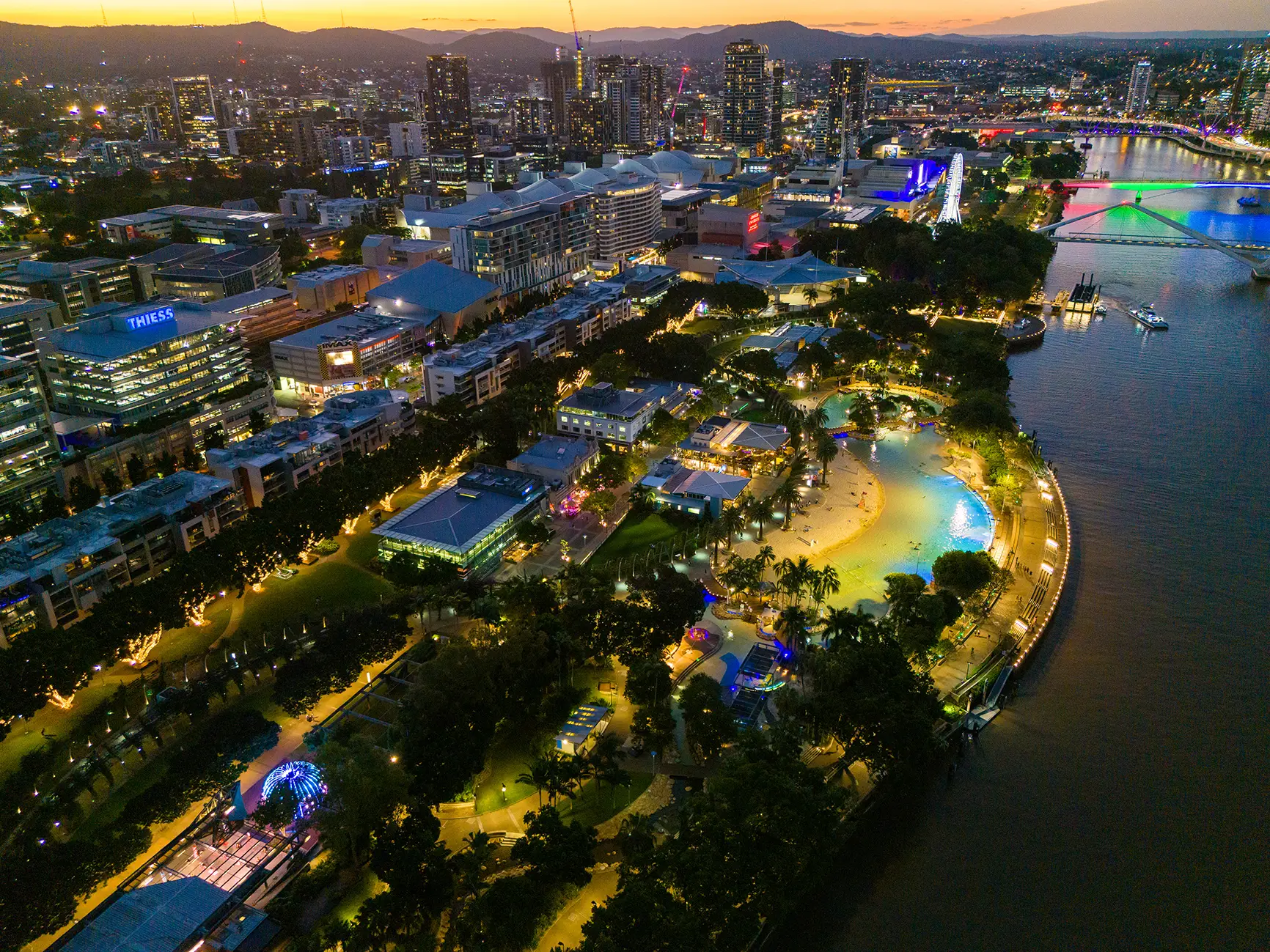 Aerial view of South Bank, Streets Beach and the Brisbane River at blue hour