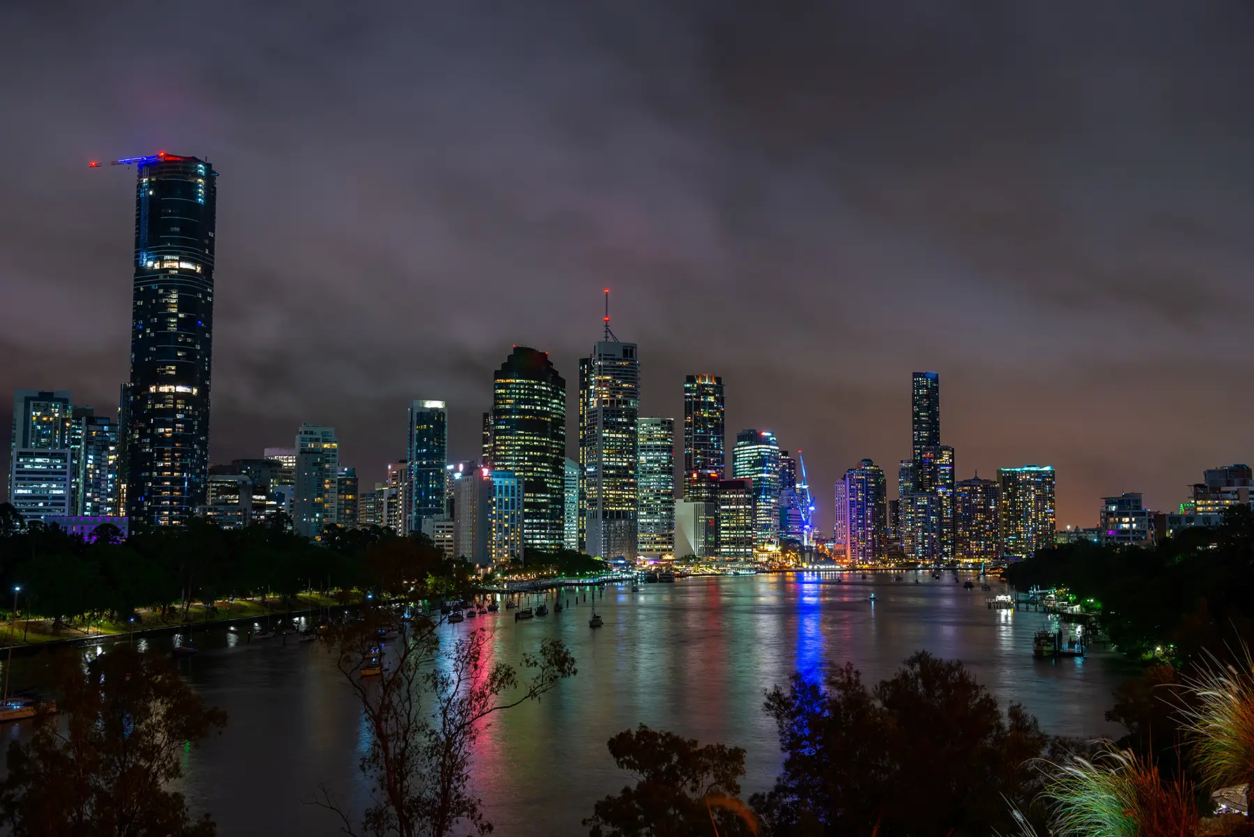 Brisbane city skyline and river illuminated at night
