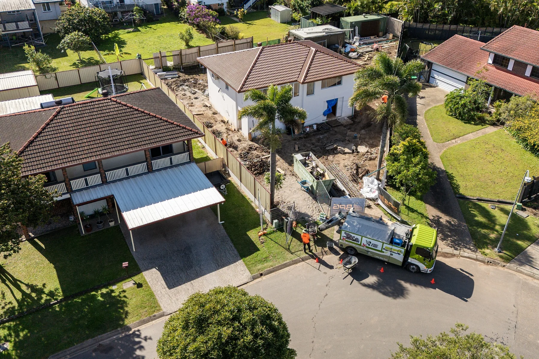 Drone view of a Concrete Taxi truck and crew working at a Brisbane site