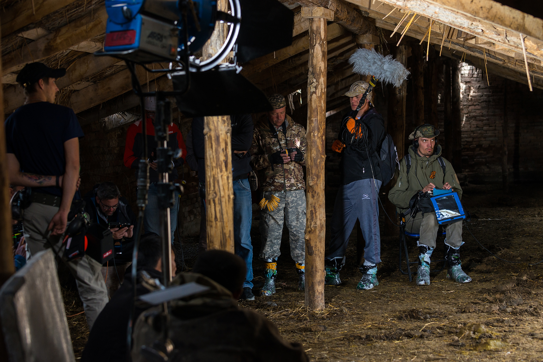 Cast and crew reviewing production monitors at video village