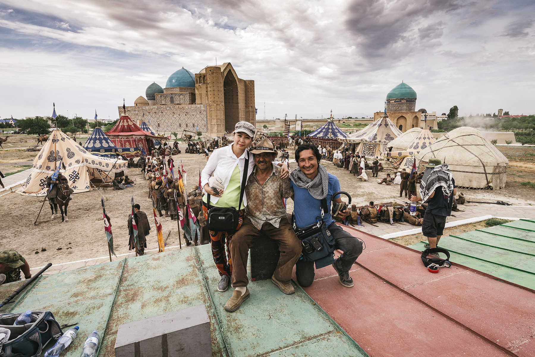 Production team photographed on location above a large period film set