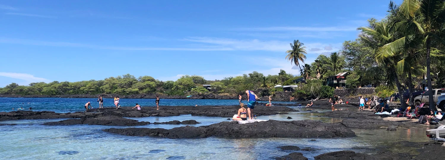 Snorkelers entering the water at Two Step lava ledge Snorkelers entering the water at Two Step lava ledge