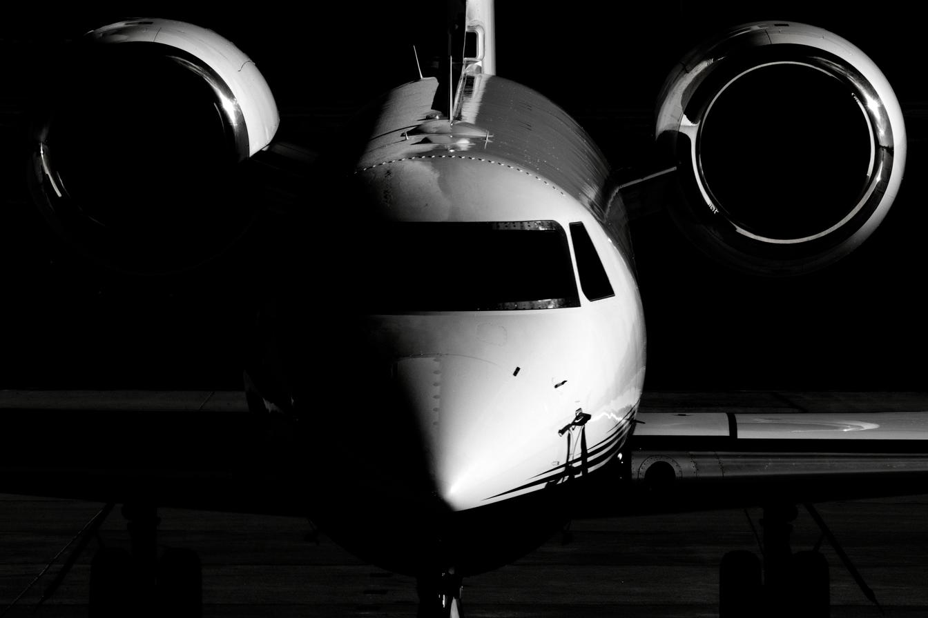 Business jet wing over open sky on an international flight