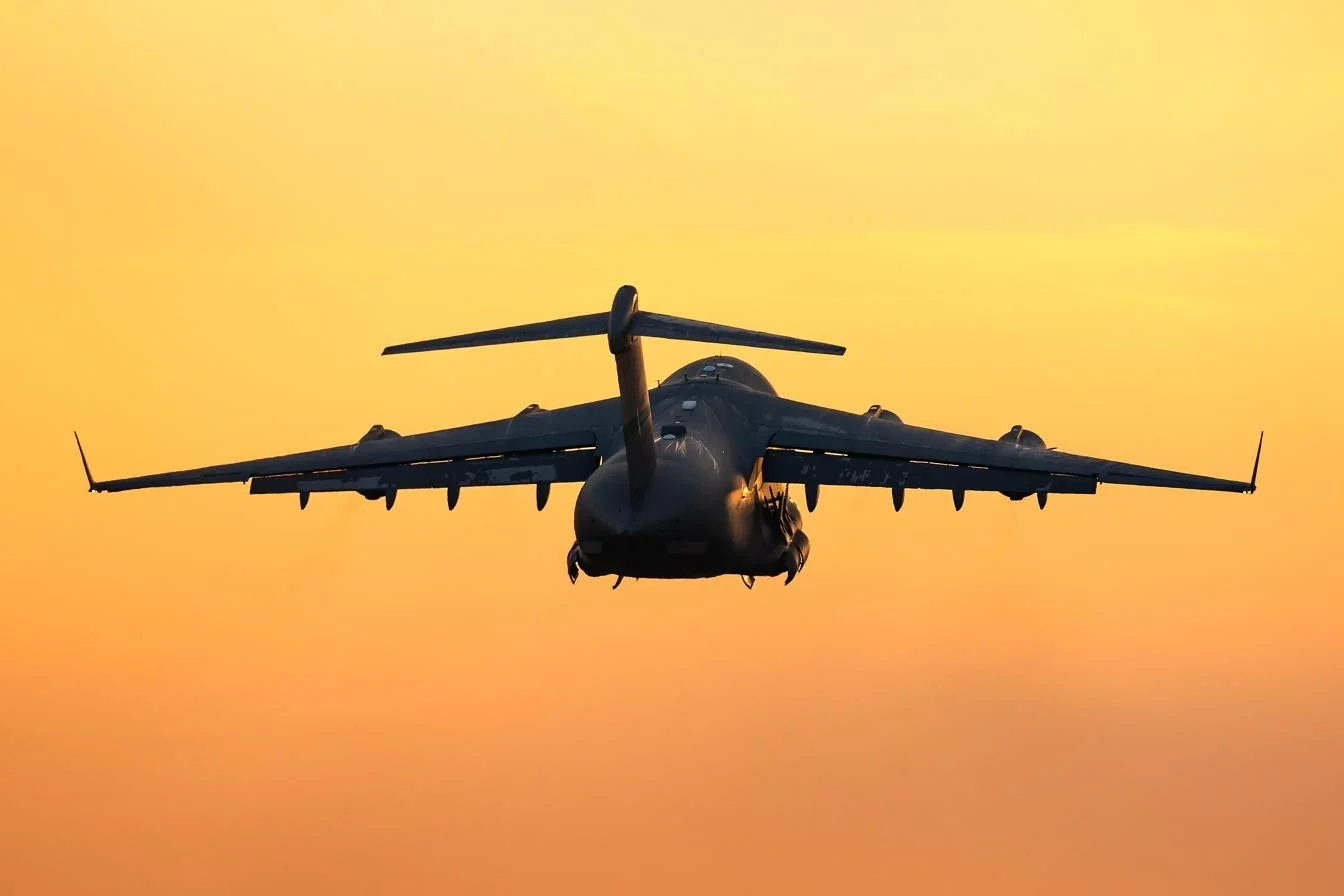 U.S. Air Force C-17 Globemaster III refueling from a KC-46 tanker with an F-16 escort during an international mission