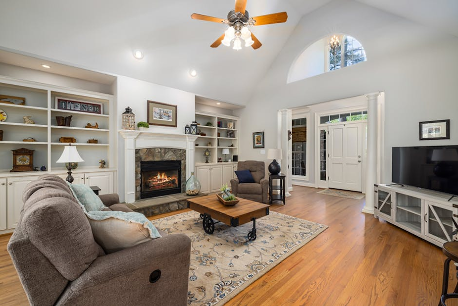 Cozy living room with a fireplace, comfortable seating, and stylish decor, highlighting a warm atmosphere ideal for winter heating solutions in Tacoma.