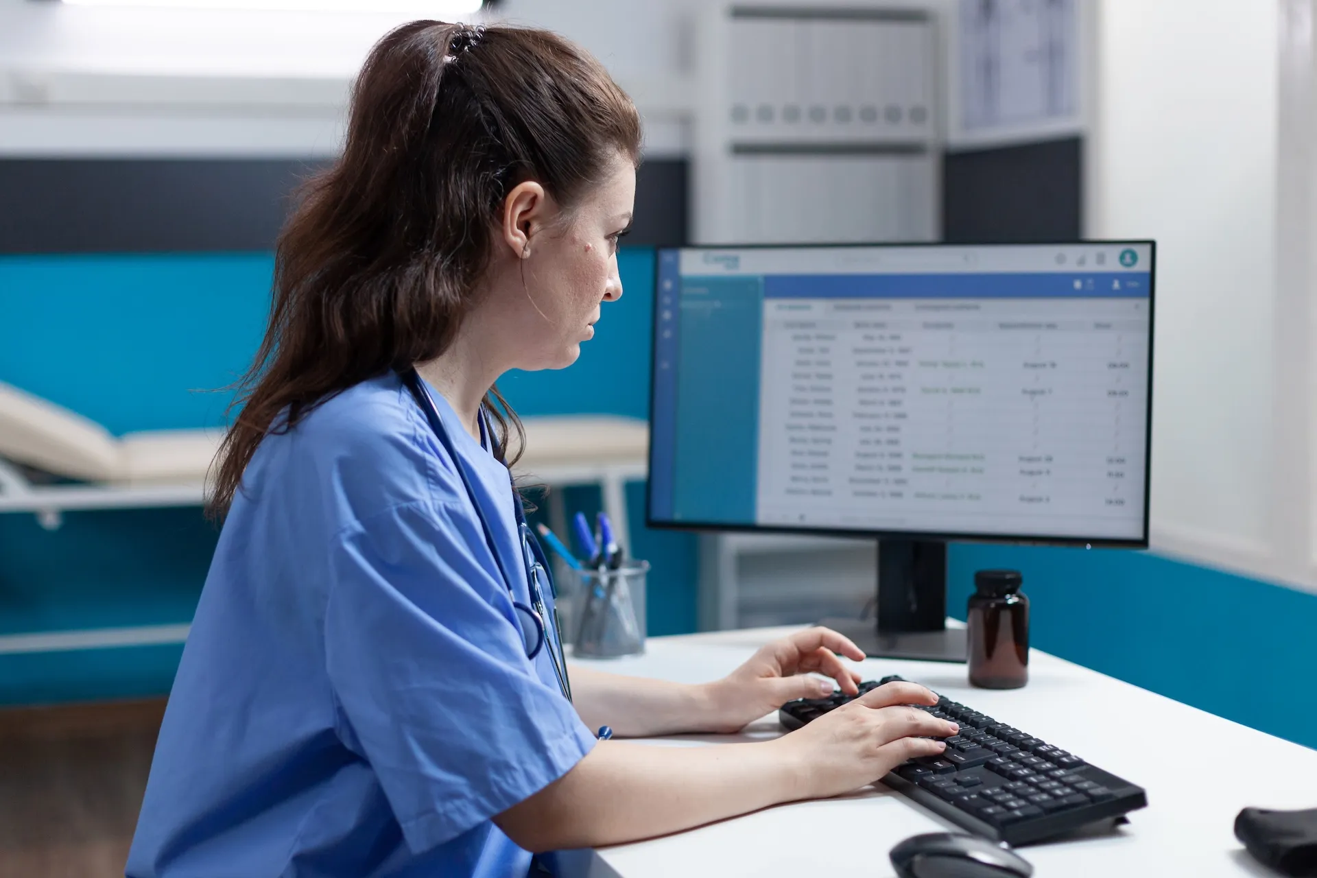 Infusion staff in blue scrubs using a common infusion technology platform.