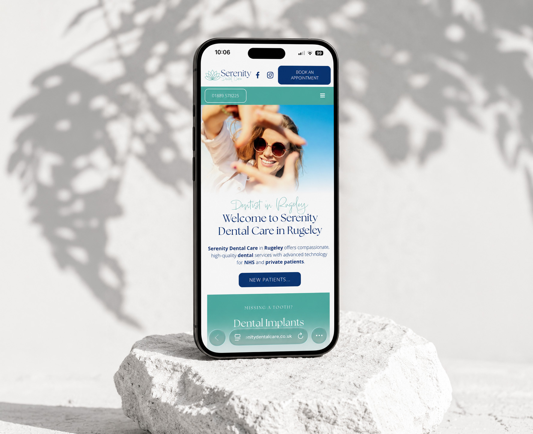 Serenity Dental Care mobile website displayed on pale stone