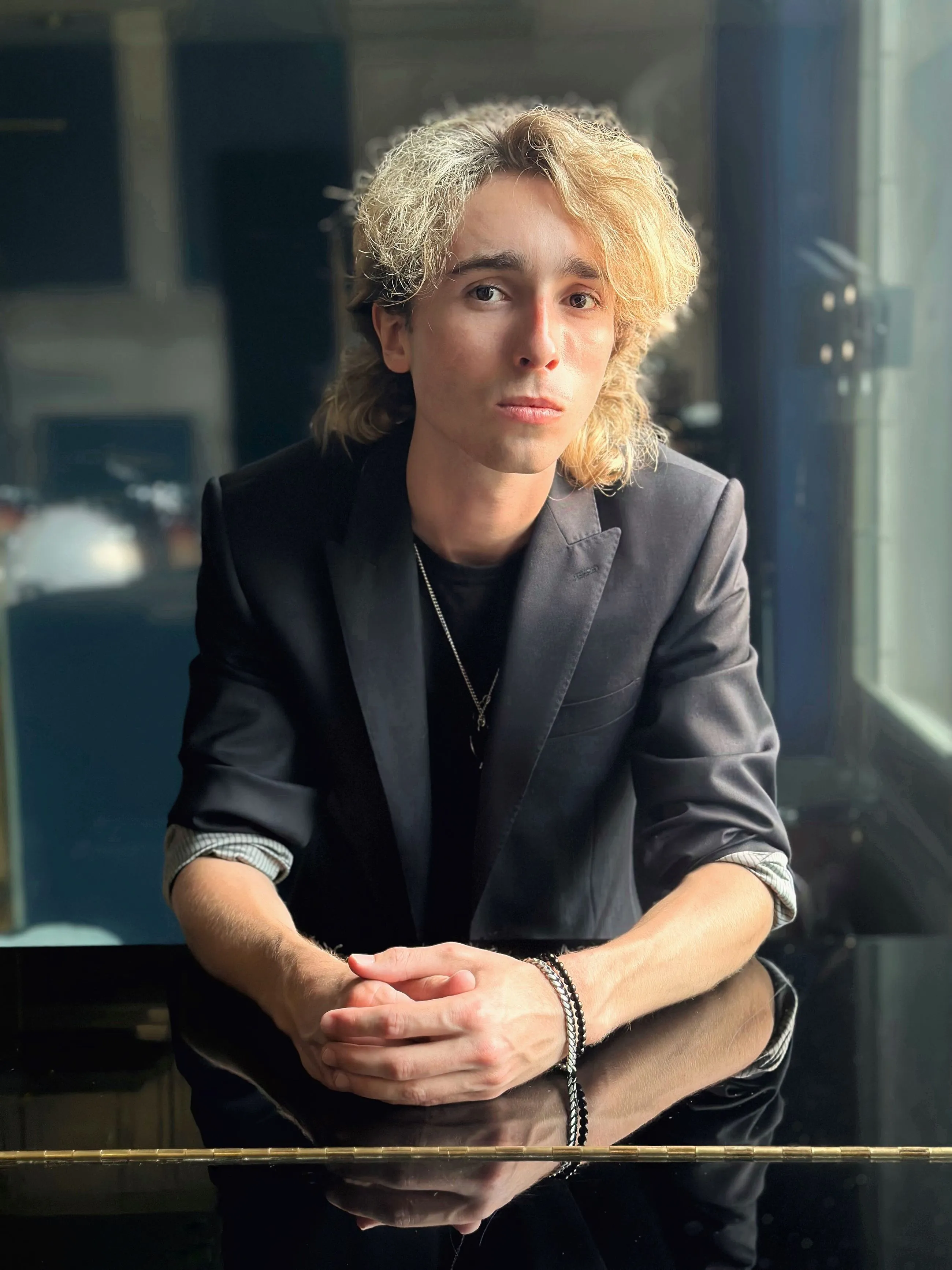 Sam Harding seated at a piano