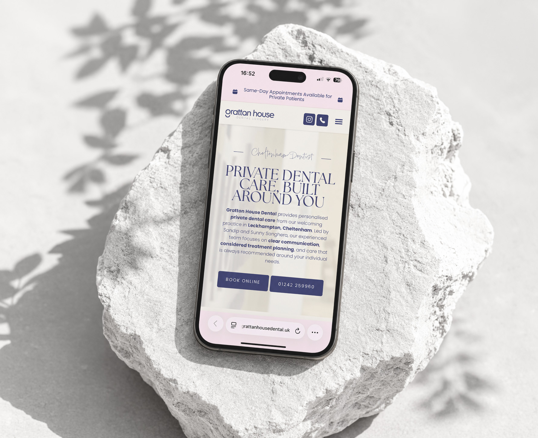 Gratton House Dental Surgery mobile website displayed on pale stone