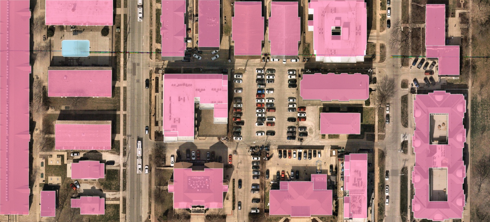 Structures and site features on a residential block: buildings, swimming pools, driveways, and fences extracted from aerial imagery