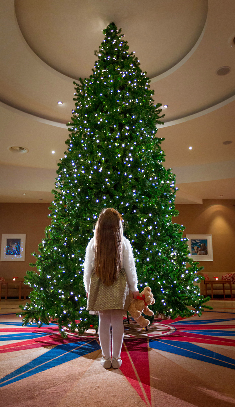 Girl @ Christmas Tree in Lobby  - Seasonal Commercial Photography © David Cantwell Photography