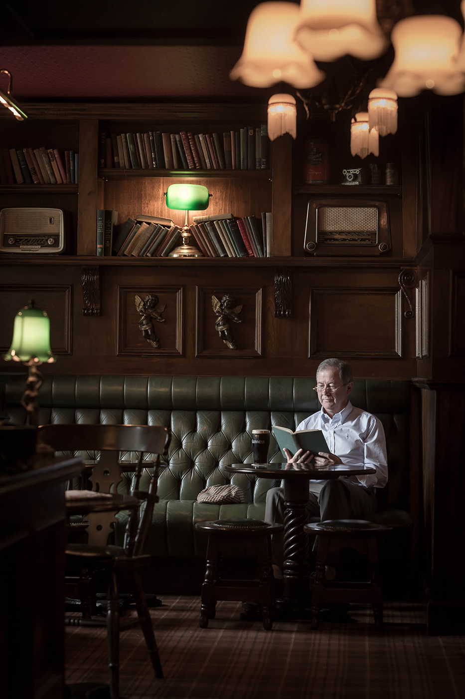Man Reading a Book With Guiness in a Bar - Food Lifestyle Photography © David Cantwell Photography