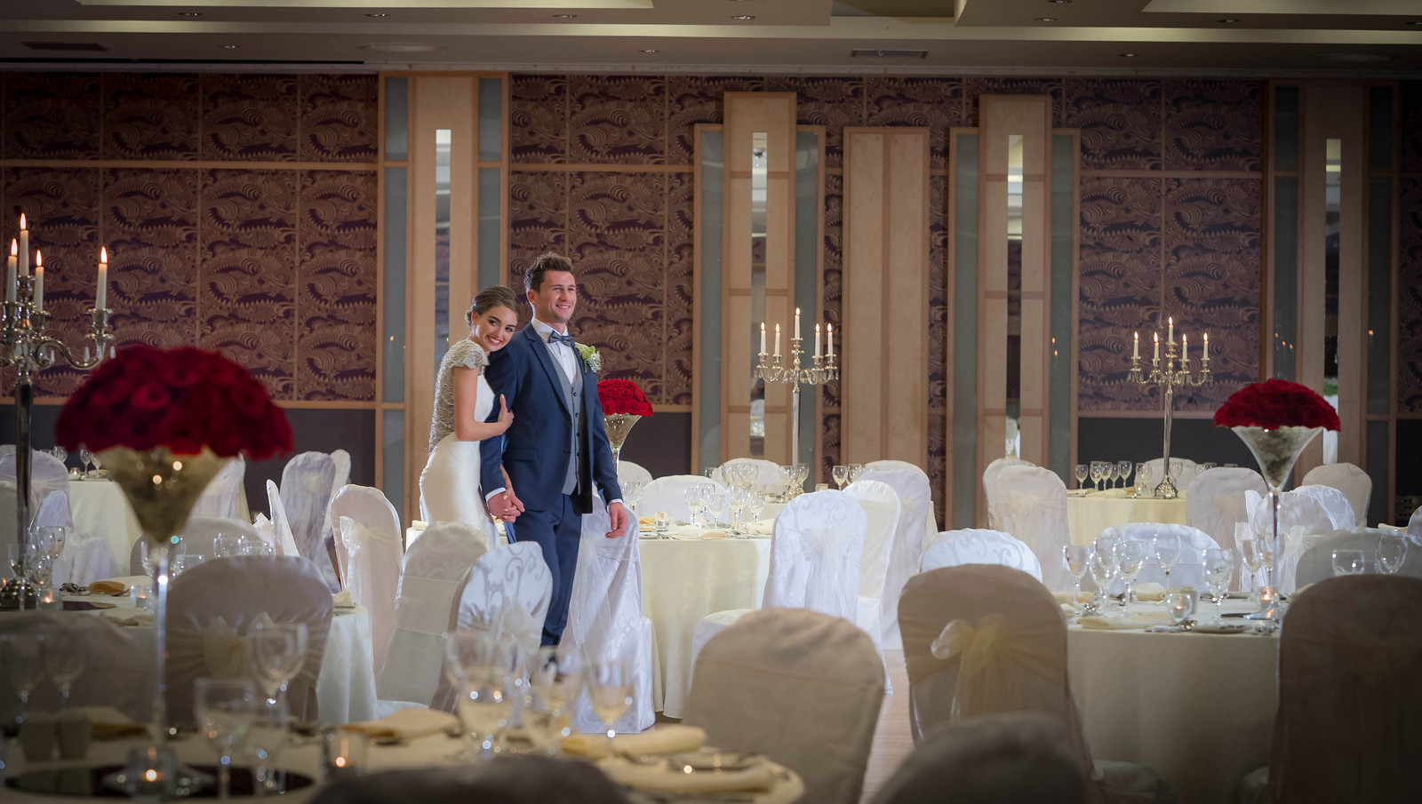 Bride & Groom Walking Through Ballroom in Shearwater Hotel Athlone - Hotel Wedding Photography © David Cantwell Photography