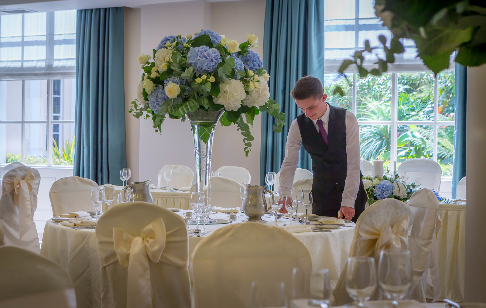 Waiter in Ballroom in Portmarnock Hotel - Hotel Wedding Photography © David Cantwell Photography