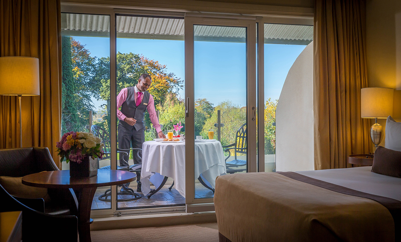 Waiter Setting a Table  in a Balcony Bedroom @ The Lyrath Hotel © David Cantwell Photography