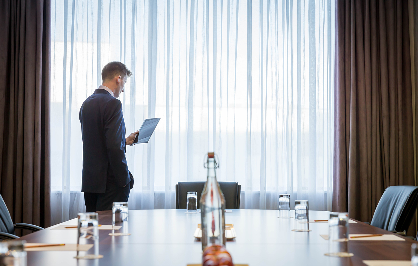 Corporate Looking at ipad in Boardroom Meeting Room- Corporate Photography © David Cantwell Photography