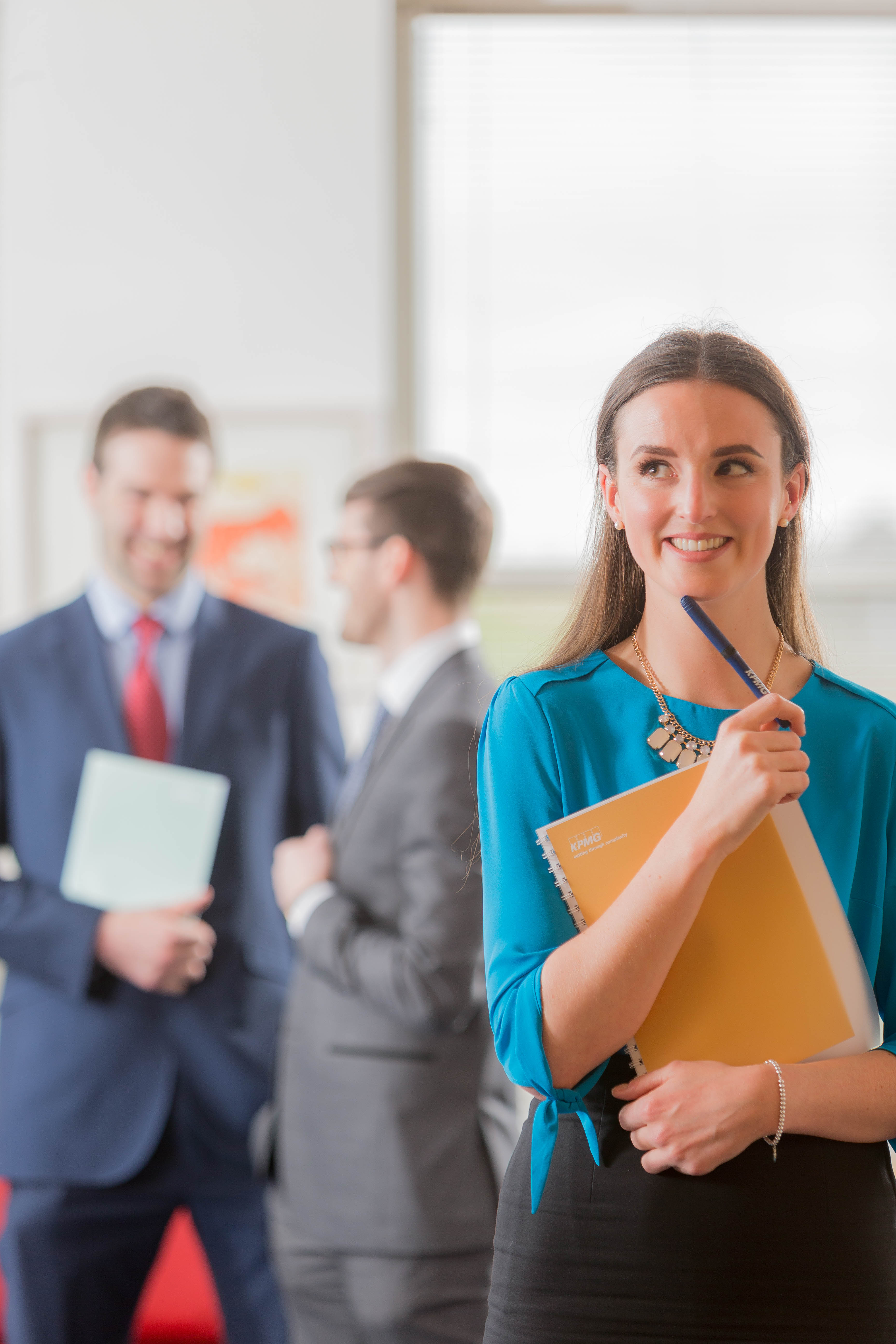 Female Corporate with Males in Background - Corporate Photography © David Cantwell Photography