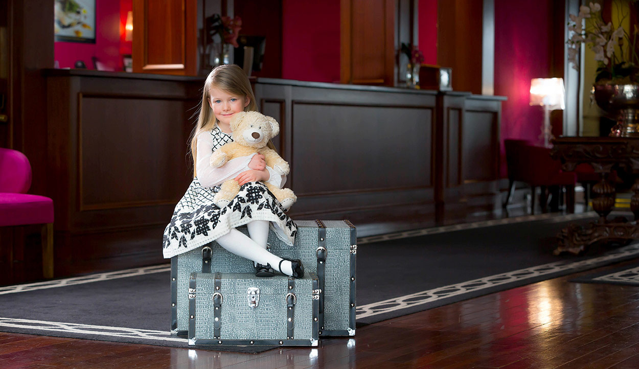 Young Girl on Suitcase - Lifestyle Photography © David Cantwell Photography