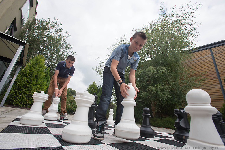 Boys Playing Giant Chess Outdoors - Lifestyle Photography © David Cantwell Photography