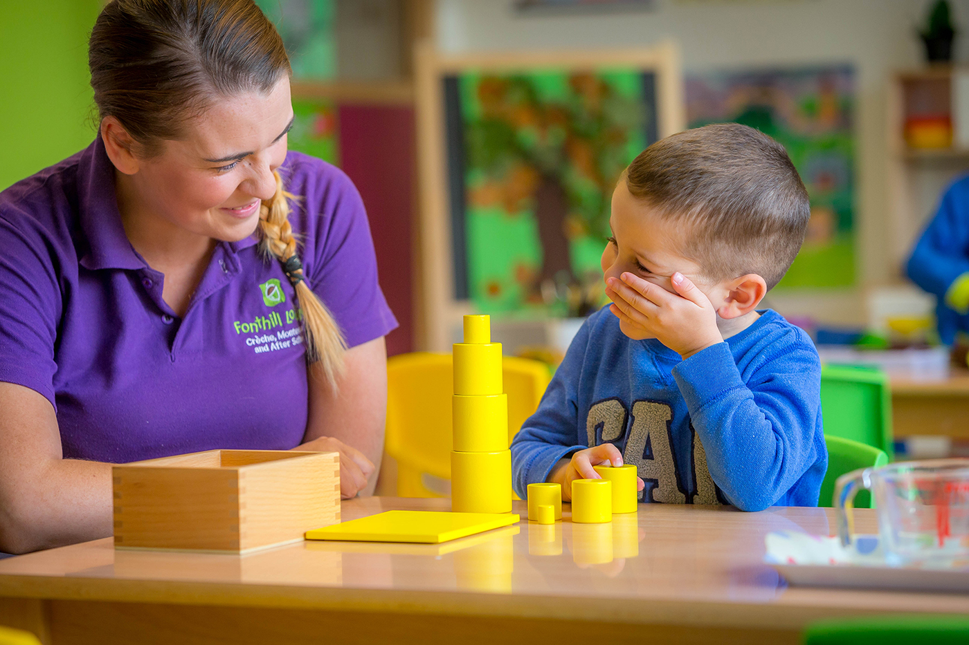 Youn Boy with Teacher in Montessori School - Lifestyle Photography © David Cantwell Photography