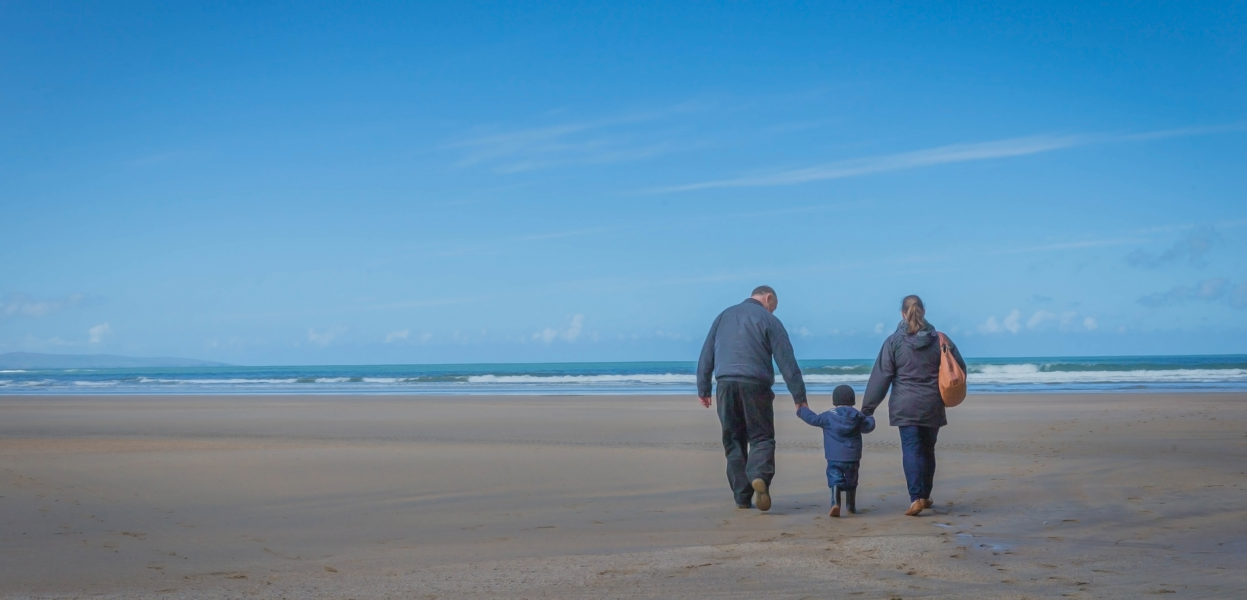 Parents and Child on Bech - Family Lifestyle Photography © David Cantwell Photography