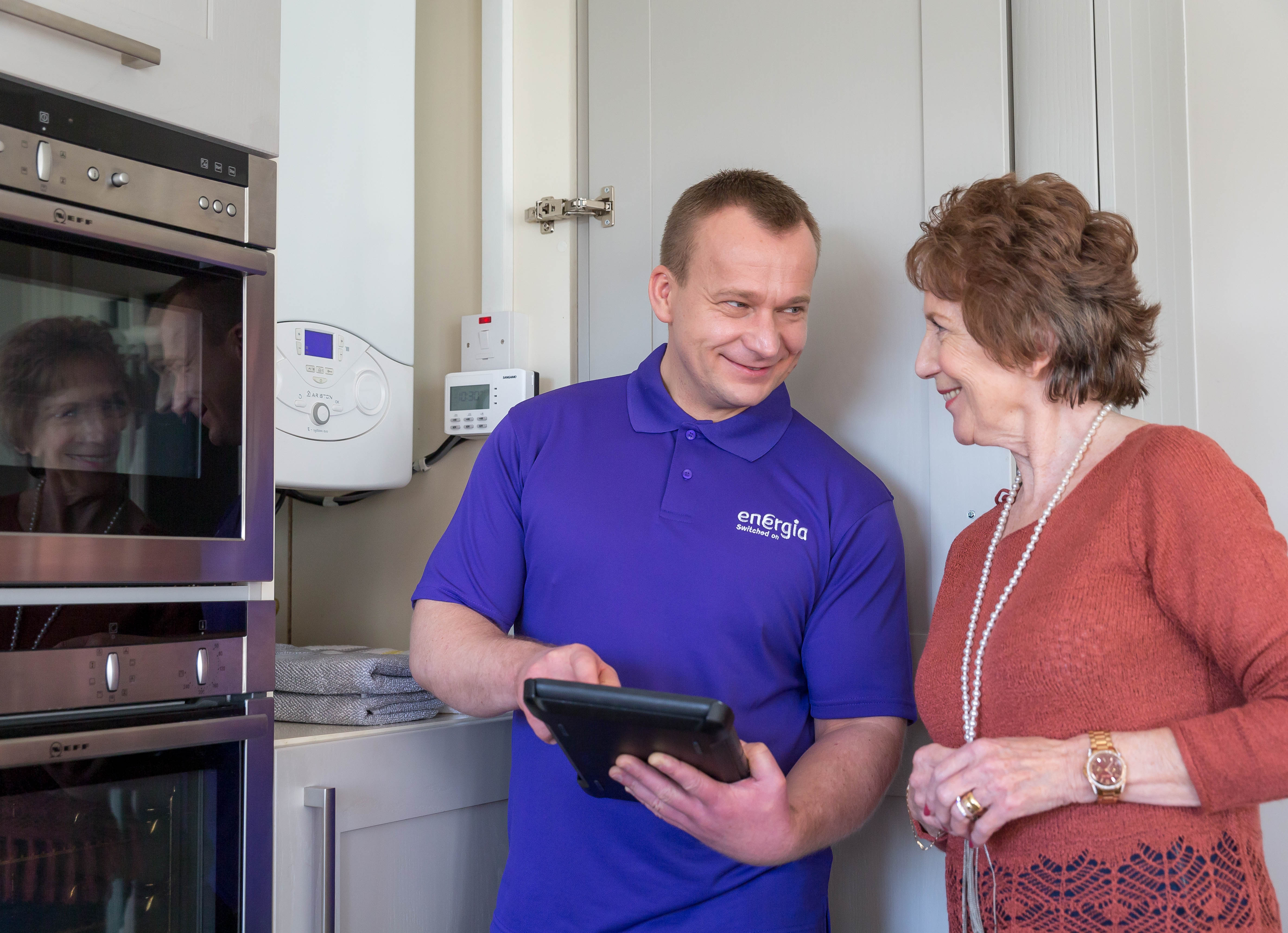 Serviceman With Female Home Owner - Service Sector Photography © David Cantwell Photography