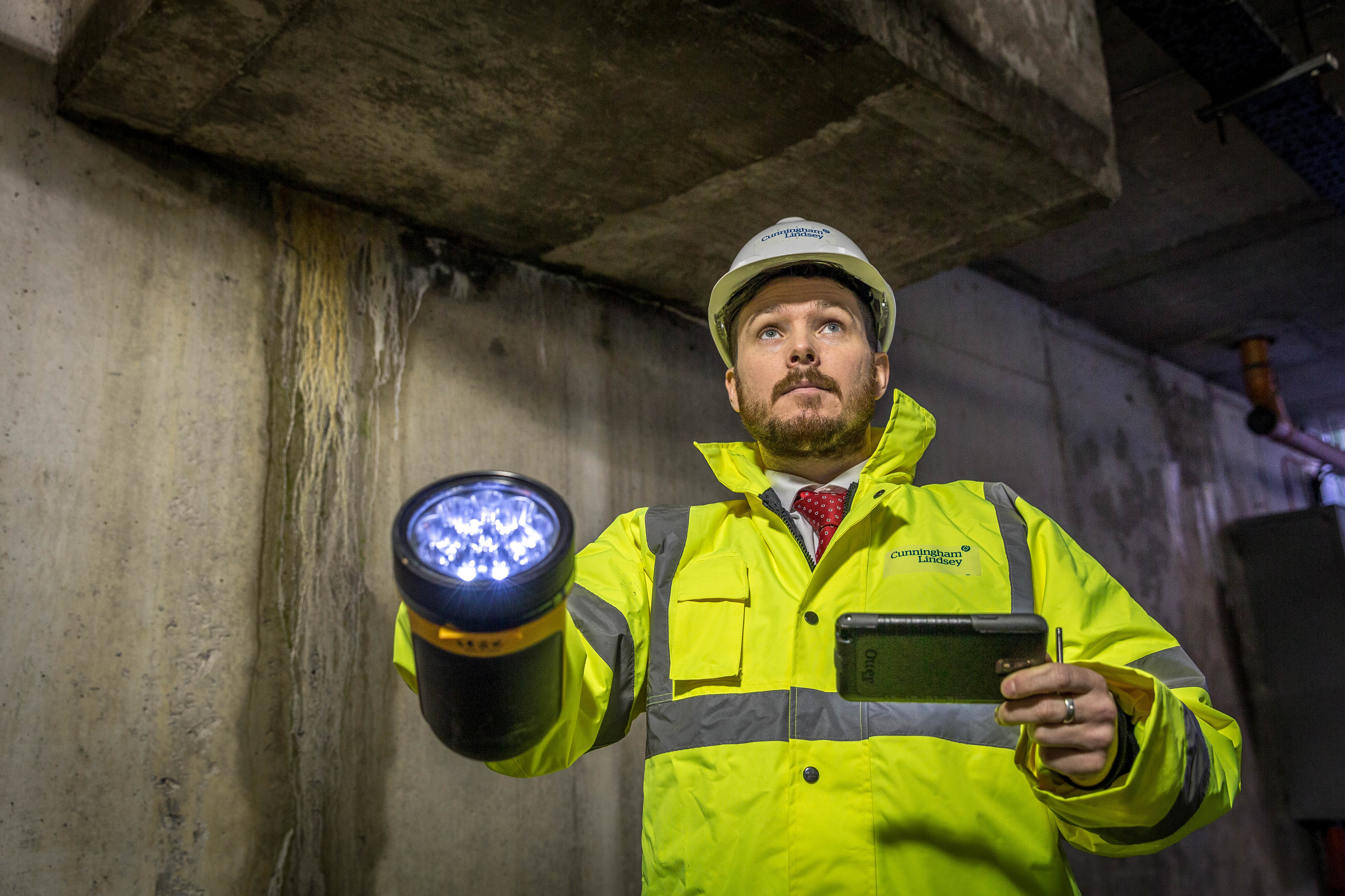 Insurance Assesor With Torch  - People At Work Photography © David Cantwell Photography