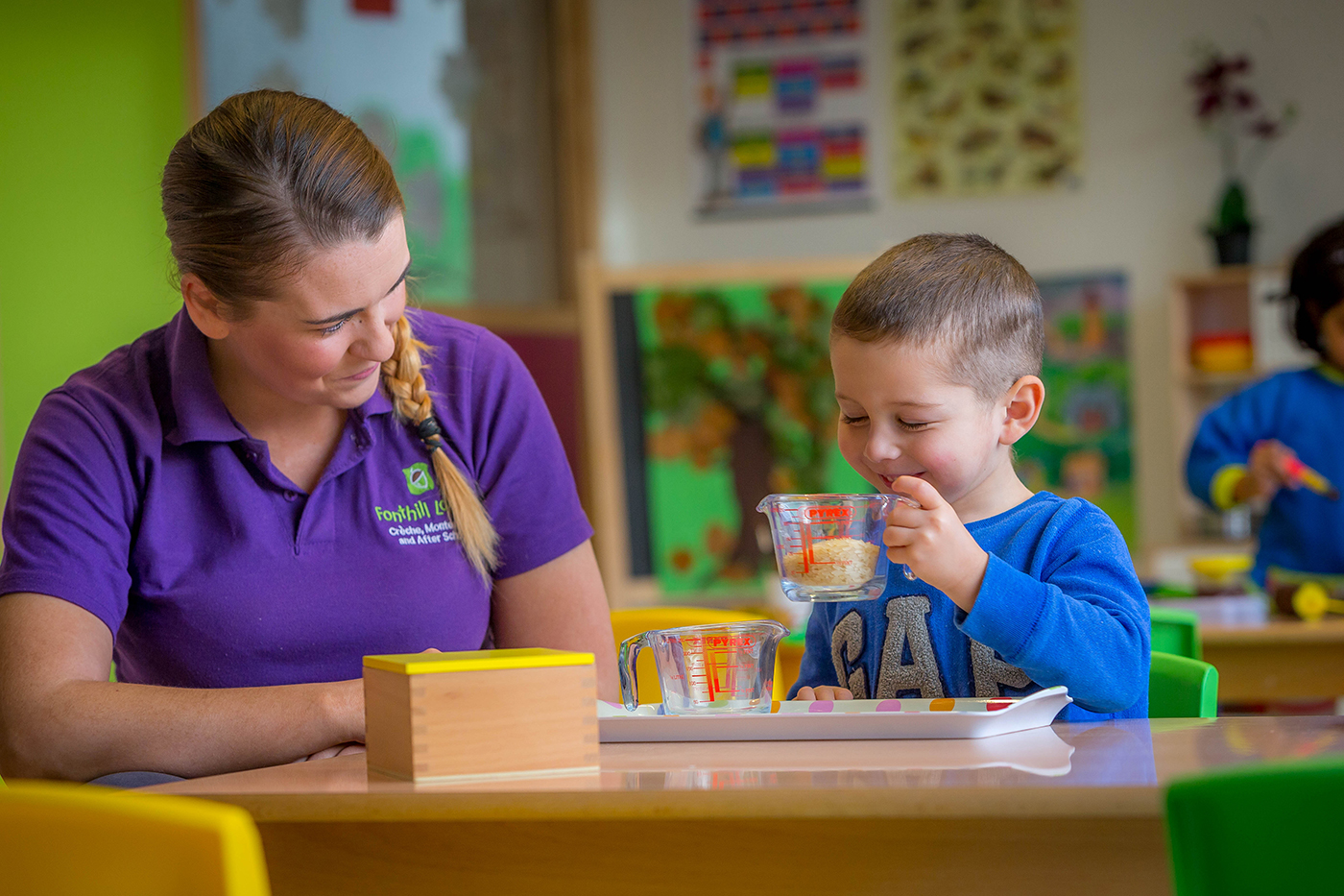 Montessori Teacher with Boy © David Cantwell Photography