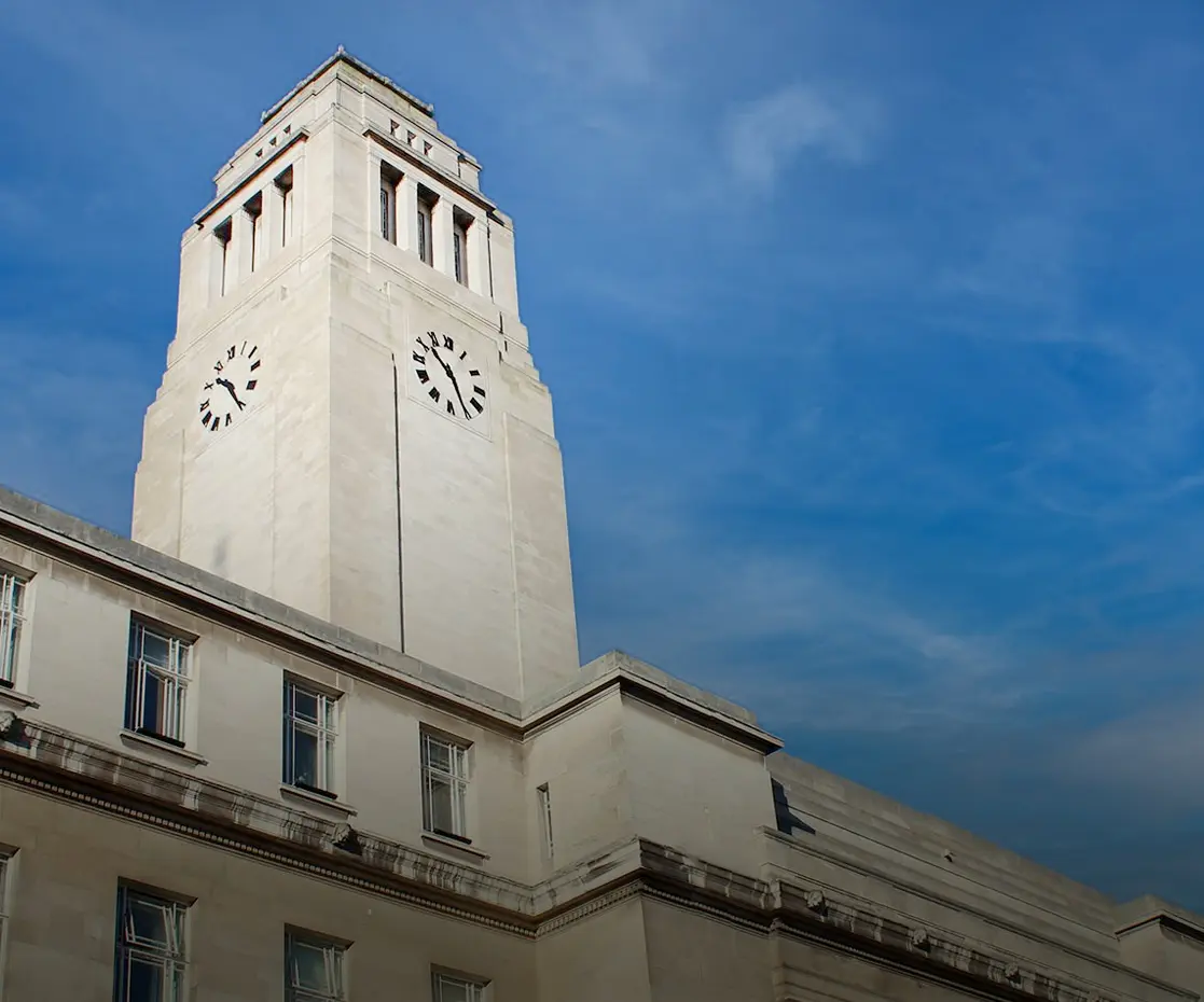 University of Leeds clock tower white marble architecture historic building blue sky.
